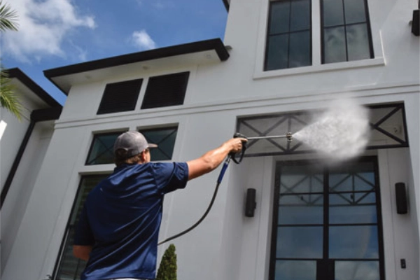 Soft washing a house
